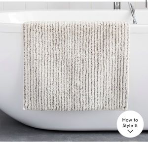 Two West Elm stripped bath mats